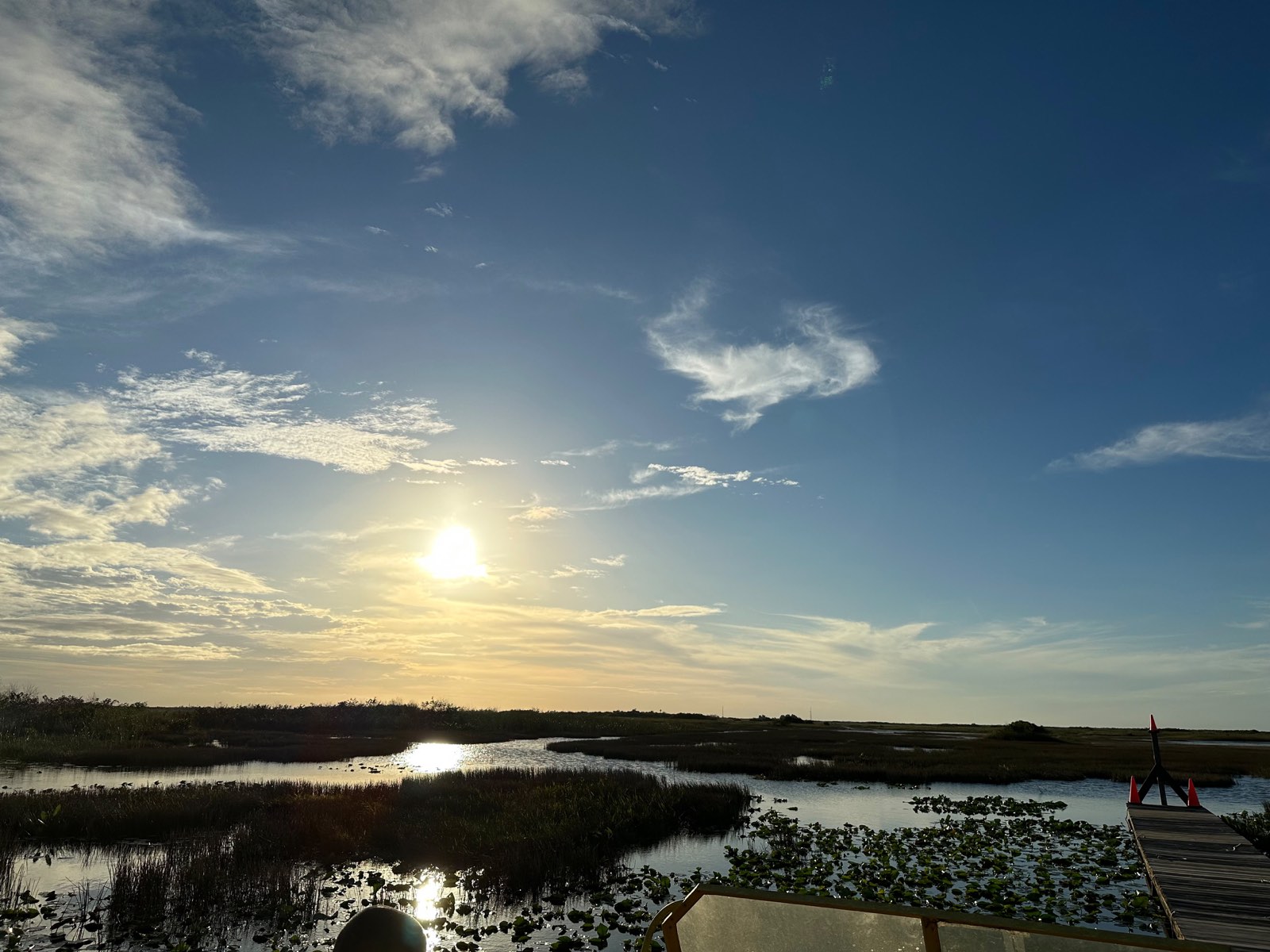 Sunlight over the Florida marsh near the church